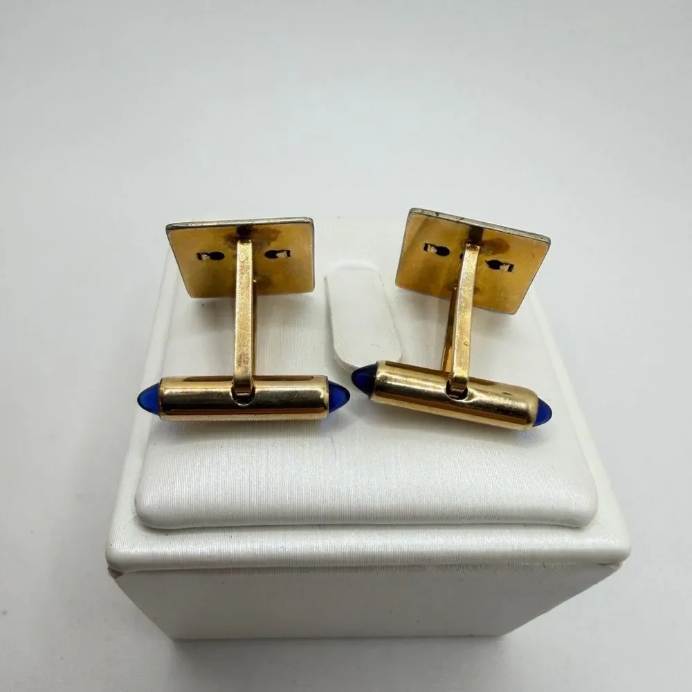 Vintage Krementz Gold tone cuff likes with princess cut blue rhinestone accents!